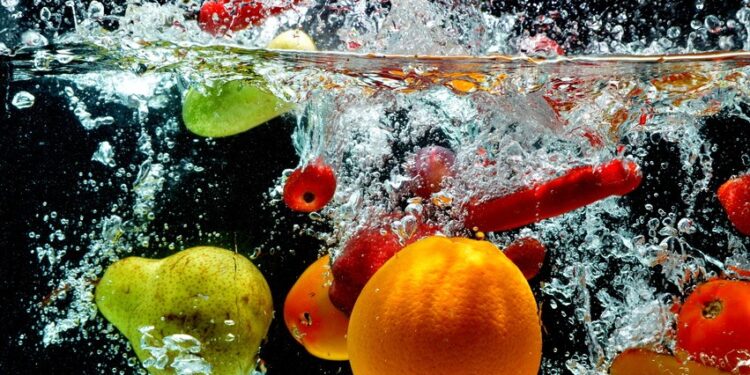 Various fresh and healthy fruit picture taken as they submerged dramatically into a clean water.