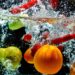 Various fresh and healthy fruit picture taken as they submerged dramatically into a clean water.